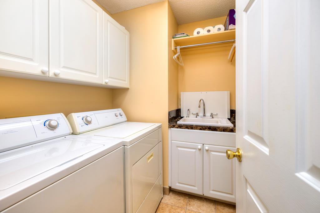 LAUNDRY ROOM WITH SINK & BUILT-IN CABINETS